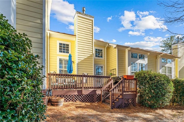 82 Pine Hawk Dr, Spring Lake, NC 28390 - rear view of house with a chimney and a deck