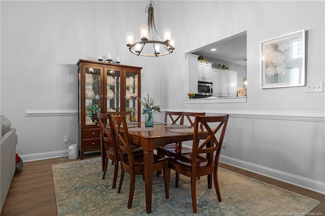 82 Pine Hawk Dr, Spring Lake, NC 28390 - dining room with a chandelier and dark wood-style floors