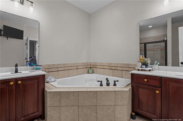 82 Pine Hawk Dr, Spring Lake, NC 28390 - bathroom featuring two vanities, a bath, and a stall shower
