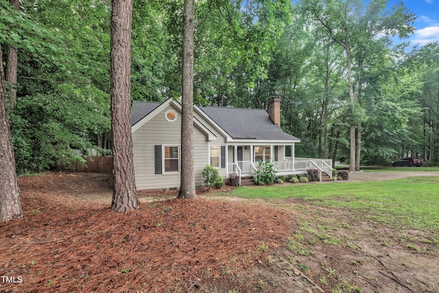 8801 Valley Hill Ct, Apex, NC 27539 - view of front of home with covered porch, a chimney, and a shingled roof