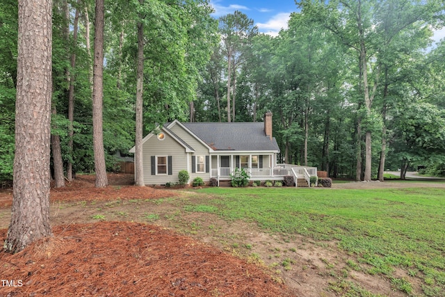 8801 Valley Hill Ct, Apex, NC 27539 - single story home featuring a chimney, covered porch, a front lawn, and a shingled roof