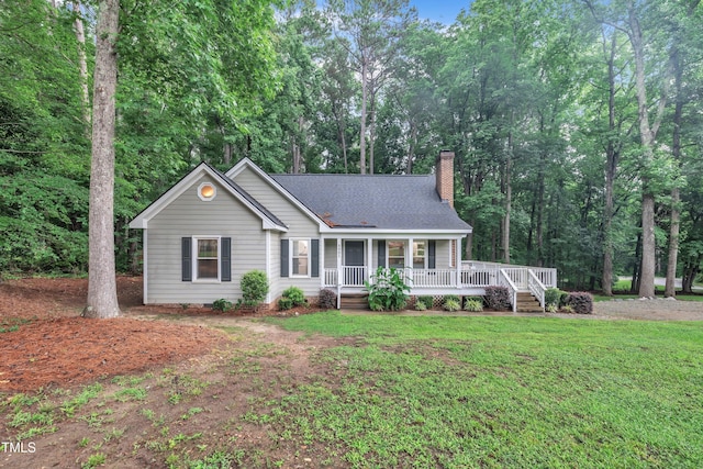 8801 Valley Hill Ct, Apex, NC 27539 - ranch-style home with covered porch, a chimney, a shingled roof, and a front yard