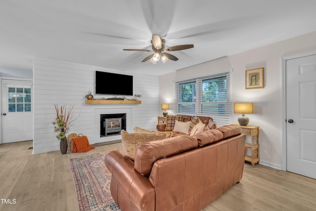 8801 Valley Hill Ct, Apex, NC 27539 - living area with a ceiling fan, light wood-style flooring, and a large fireplace