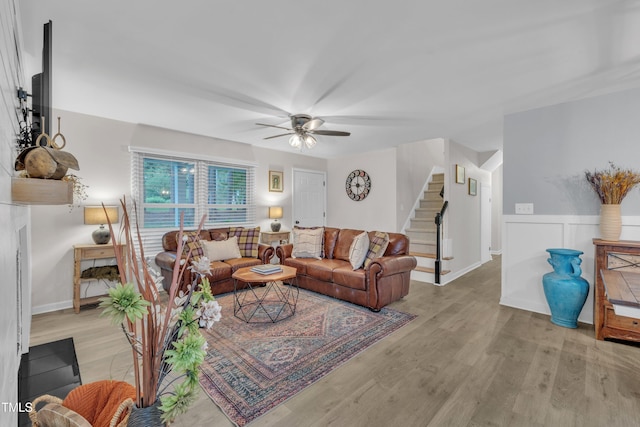 8801 Valley Hill Ct, Apex, NC 27539 - living area featuring stairs, a ceiling fan, and light wood-style flooring