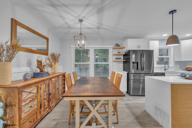 8801 Valley Hill Ct, Apex, NC 27539 - dining area featuring a chandelier, light wood-type flooring, and recessed lighting