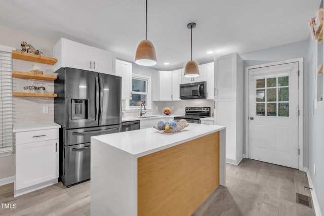 8801 Valley Hill Ct, Apex, NC 27539 - kitchen featuring appliances with stainless steel finishes, backsplash, white cabinetry, and recessed lighting