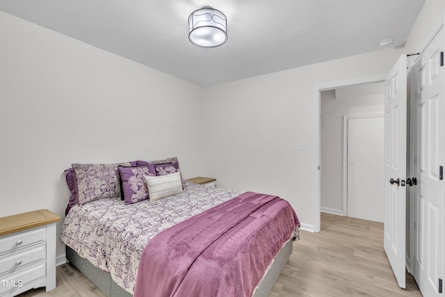 8801 Valley Hill Ct, Apex, NC 27539 - bedroom with light wood-style flooring and baseboards