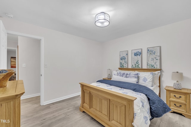 8801 Valley Hill Ct, Apex, NC 27539 - bedroom with light wood-type flooring and baseboards
