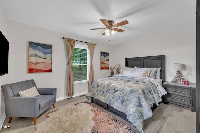 8801 Valley Hill Ct, Apex, NC 27539 - bedroom featuring light wood-style flooring and a ceiling fan