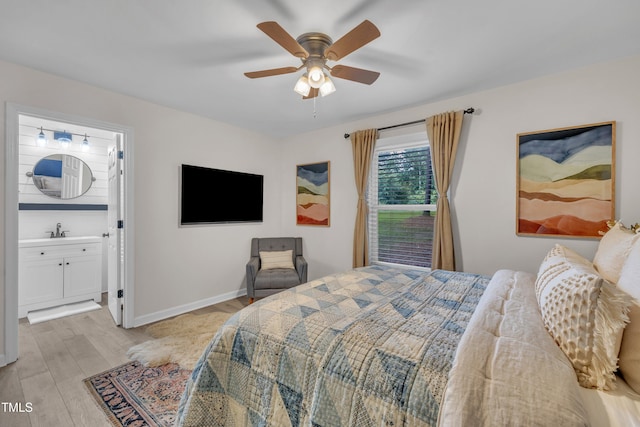 8801 Valley Hill Ct, Apex, NC 27539 - bedroom with light wood finished floors, connected bathroom, and a ceiling fan