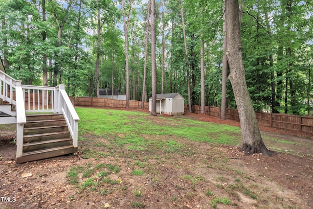 8801 Valley Hill Ct, Apex, NC 27539 - fenced backyard with a shed, stairway, a deck, and view of scattered trees