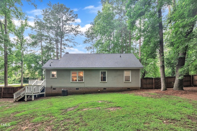 8801 Valley Hill Ct, Apex, NC 27539 - back of property with crawl space, a fenced backyard, roof with shingles, and a deck