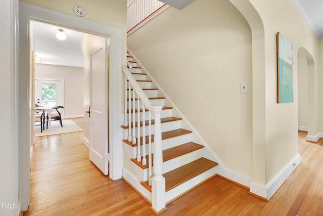 1007 W Markham Ave, Durham, NC 27701 - staircase with wood finished floors and arched walkways