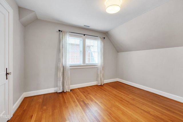 1007 W Markham Ave, Durham, NC 27701 - bonus room with lofted ceiling and light wood-style floors