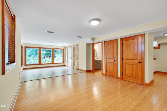 1007 W Markham Ave, Durham, NC 27701 - spare room with light wood finished floors and baseboards