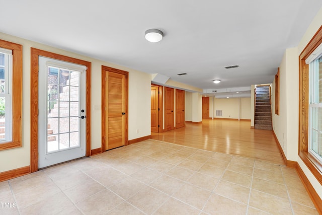 1007 W Markham Ave, Durham, NC 27701 - foyer featuring stairway and light tile patterned flooring