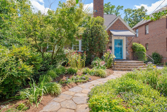 1007 W Markham Ave, Durham, NC 27701 - entrance to property with brick siding and a chimney