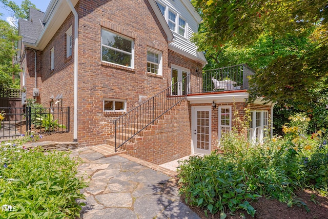 1007 W Markham Ave, Durham, NC 27701 - property entrance with brick siding, a patio, and french doors