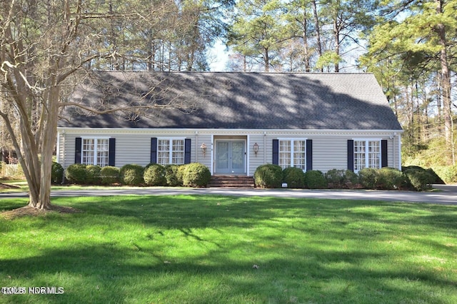 322 Gravley Dr, Rocky Mount, NC 27804 - cape cod house with a front yard, a shingled roof, and entry steps