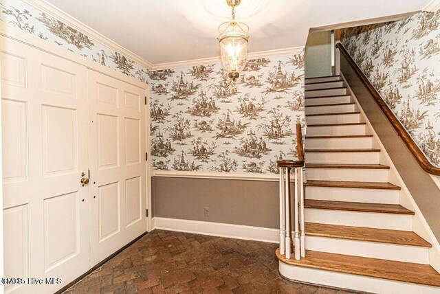 322 Gravley Dr, Rocky Mount, NC 27804 - stairs featuring brick floors, crown molding, and wallpapered walls