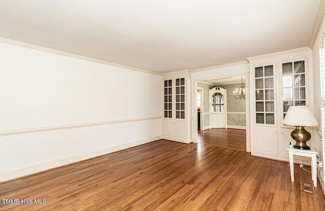322 Gravley Dr, Rocky Mount, NC 27804 - empty room featuring crown molding, a chandelier, and wood finished floors