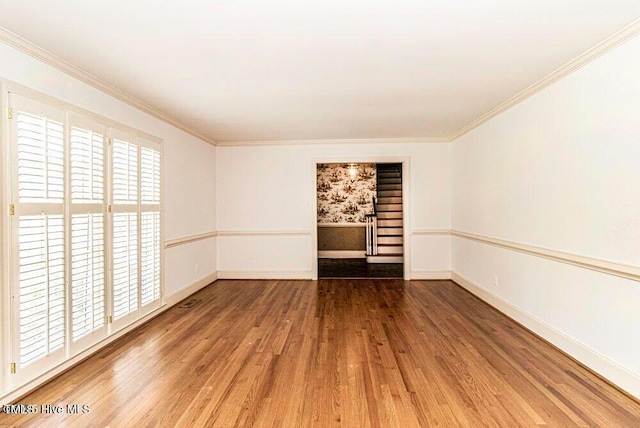 322 Gravley Dr, Rocky Mount, NC 27804 - empty room with wood finished floors and ornamental molding