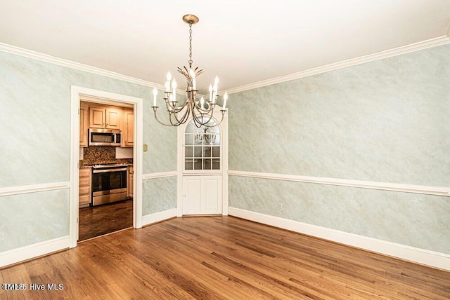 322 Gravley Dr, Rocky Mount, NC 27804 - unfurnished dining area featuring a chandelier, wood finished floors, and ornamental molding