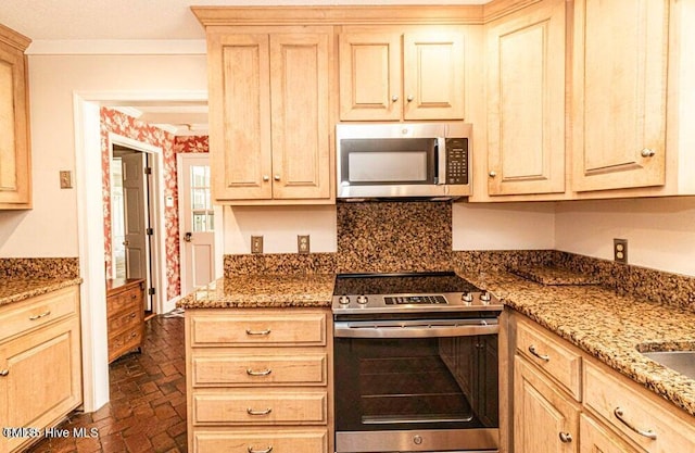322 Gravley Dr, Rocky Mount, NC 27804 - kitchen with appliances with stainless steel finishes, brick floors, light stone countertops, and light brown cabinetry