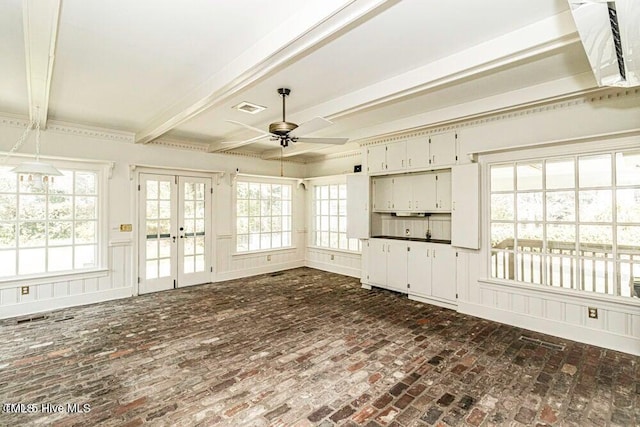 322 Gravley Dr, Rocky Mount, NC 27804 - unfurnished living room with a ceiling fan, french doors, beamed ceiling, and brick flooring
