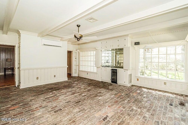 322 Gravley Dr, Rocky Mount, NC 27804 - unfurnished living room with a wall mounted air conditioner, beamed ceiling, a ceiling fan, wine cooler, and a dry bar