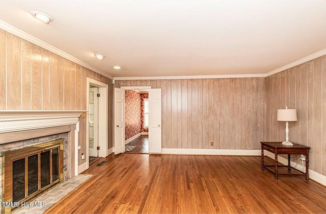 322 Gravley Dr, Rocky Mount, NC 27804 - unfurnished living room featuring wood finished floors, crown molding, and a glass covered fireplace
