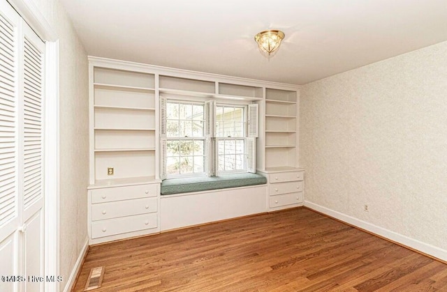 322 Gravley Dr, Rocky Mount, NC 27804 - unfurnished bedroom featuring light wood-type flooring and baseboards