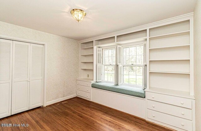 322 Gravley Dr, Rocky Mount, NC 27804 - unfurnished bedroom with dark wood finished floors and a closet