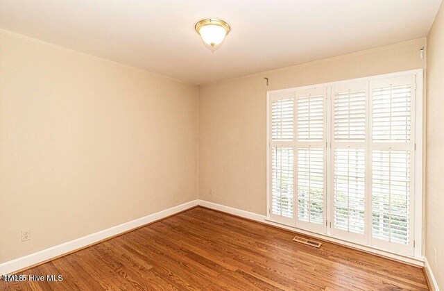 322 Gravley Dr, Rocky Mount, NC 27804 - empty room with baseboards and wood finished floors