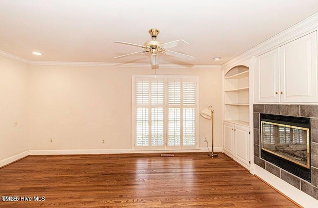 322 Gravley Dr, Rocky Mount, NC 27804 - unfurnished living room with a ceiling fan, a fireplace, wood finished floors, crown molding, and recessed lighting
