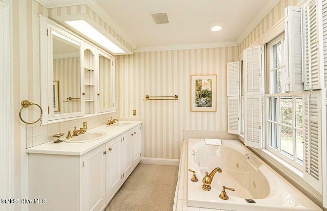 322 Gravley Dr, Rocky Mount, NC 27804 - bathroom featuring wallpapered walls, double vanity, healthy amount of natural light, a jetted tub, and ornamental molding