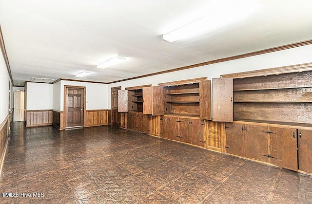 322 Gravley Dr, Rocky Mount, NC 27804 - spare room with wainscoting and ornamental molding