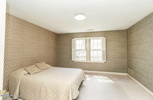 322 Gravley Dr, Rocky Mount, NC 27804 - carpeted bedroom featuring baseboards