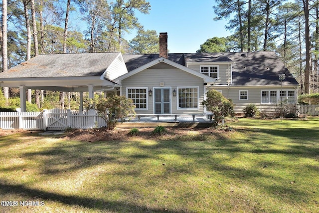 322 Gravley Dr, Rocky Mount, NC 27804 - rear view of house with a chimney and a wooden deck