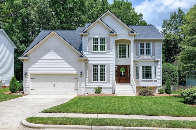 8841 Deerland Grove Dr, Raleigh, NC 27615 - view of front facade with concrete driveway, an attached garage, and roof with shingles