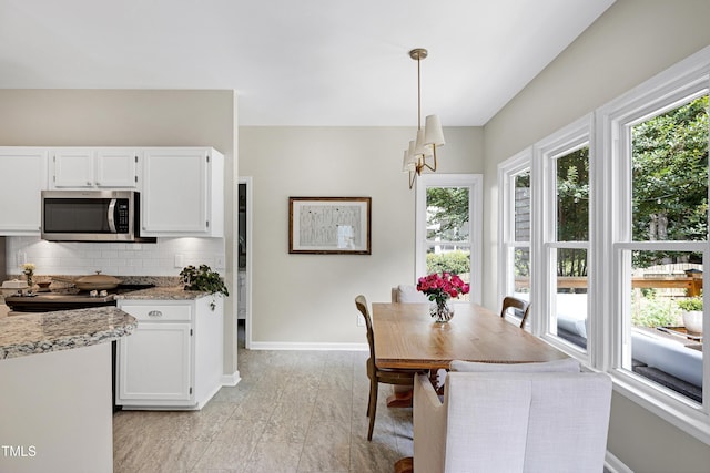 8841 Deerland Grove Dr, Raleigh, NC 27615 - dining room featuring baseboards