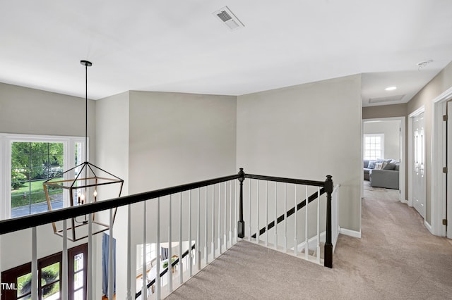 8841 Deerland Grove Dr, Raleigh, NC 27615 - hall with an upstairs landing and carpet flooring