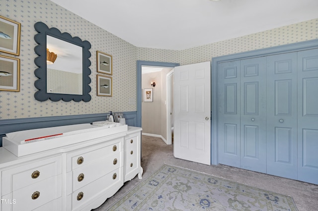 8841 Deerland Grove Dr, Raleigh, NC 27615 - bedroom with wallpapered walls, light colored carpet, and a closet