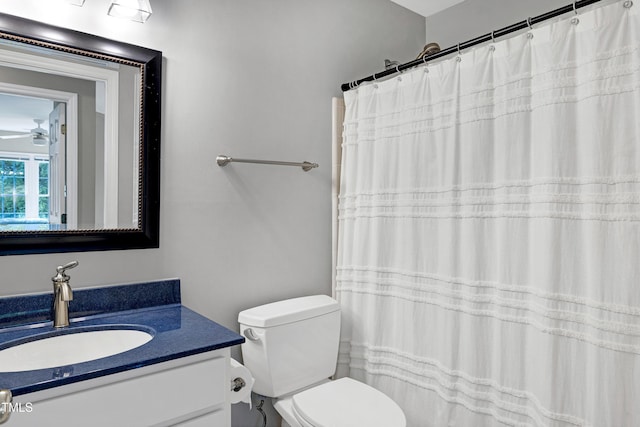 8841 Deerland Grove Dr, Raleigh, NC 27615 - full bath featuring vanity, a ceiling fan, and a shower with shower curtain