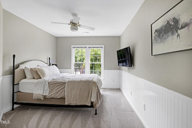 8841 Deerland Grove Dr, Raleigh, NC 27615 - bedroom featuring a wainscoted wall, carpet, and a ceiling fan
