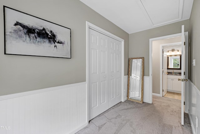 8841 Deerland Grove Dr, Raleigh, NC 27615 - corridor featuring a wainscoted wall and carpet