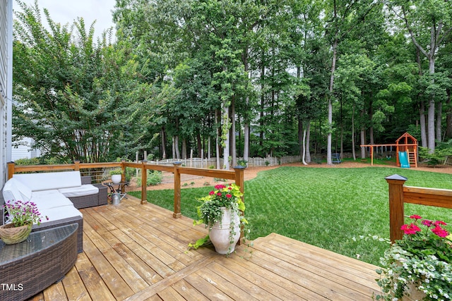 8841 Deerland Grove Dr, Raleigh, NC 27615 - deck featuring a playground, a fenced backyard, an outdoor hangout area, and view of wooded area