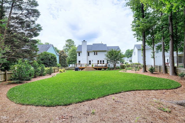 8841 Deerland Grove Dr, Raleigh, NC 27615 - fenced backyard with a wooden deck