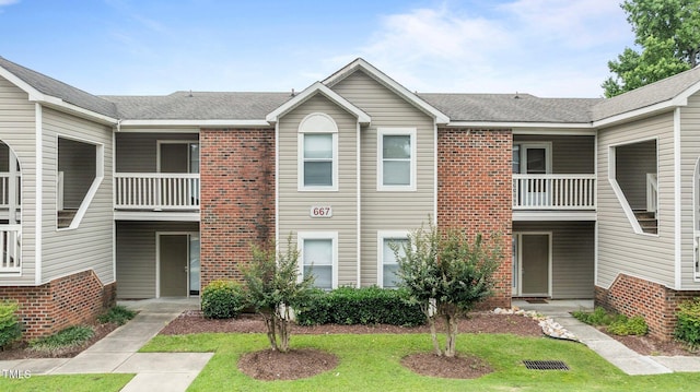 667 Bartons Lndg Unit 8, Fayetteville, NC 28314 - view of front of house featuring brick siding and a balcony