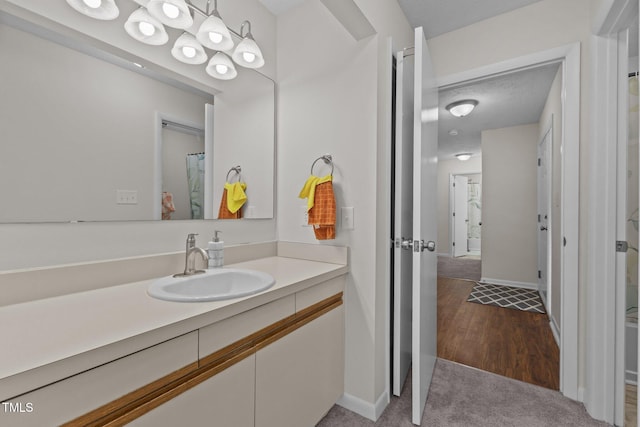 667 Bartons Lndg Unit 8, Fayetteville, NC 28314 - bathroom featuring vanity and wood finished floors
